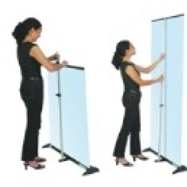 Retractable banner stand for posters and banners next to a girl by Brooks Duplicator.
