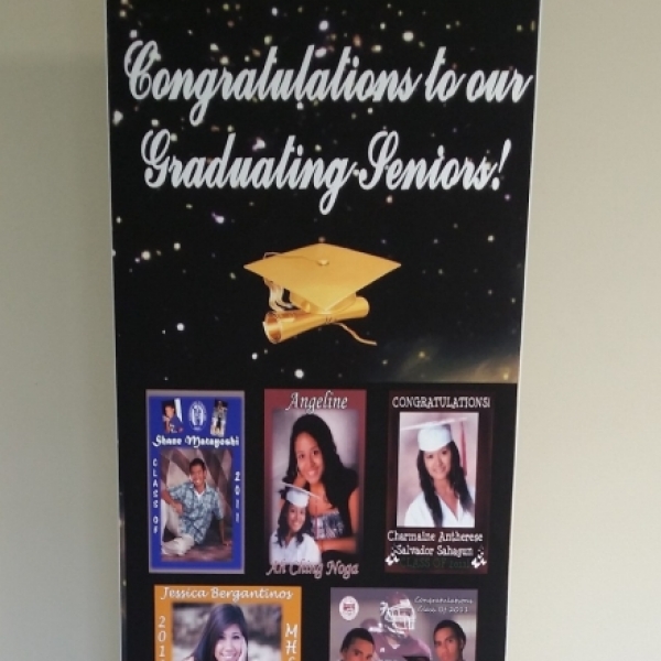 Graduating seniors banner with senior photos on retractable banner stand by Brooks.