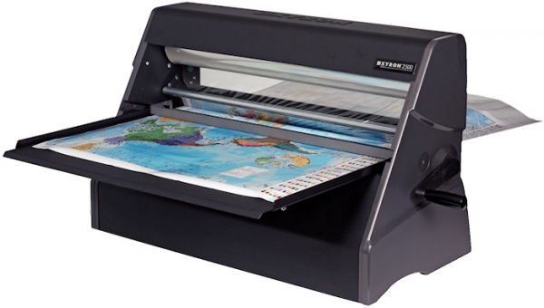 Cold laminator by Brooks Duplicator laminating color world map with handle.
